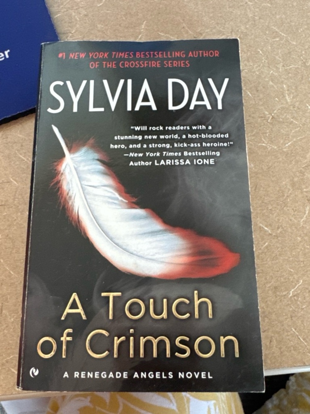 Original Penguin Black Paperback Book Cover with Red and White Feather